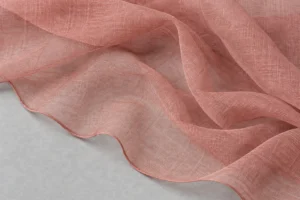 Sheer dusty-rose silk chiffon draped in floating layers