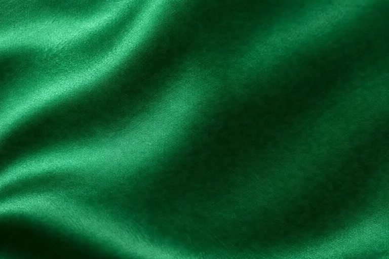 Silk Satin (Charmeuse): close-up of glossy emerald silk satin charmeuse